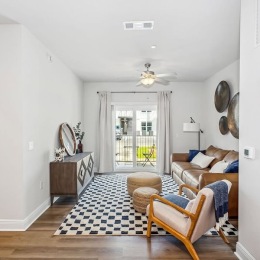 a living room with a couch and chairs