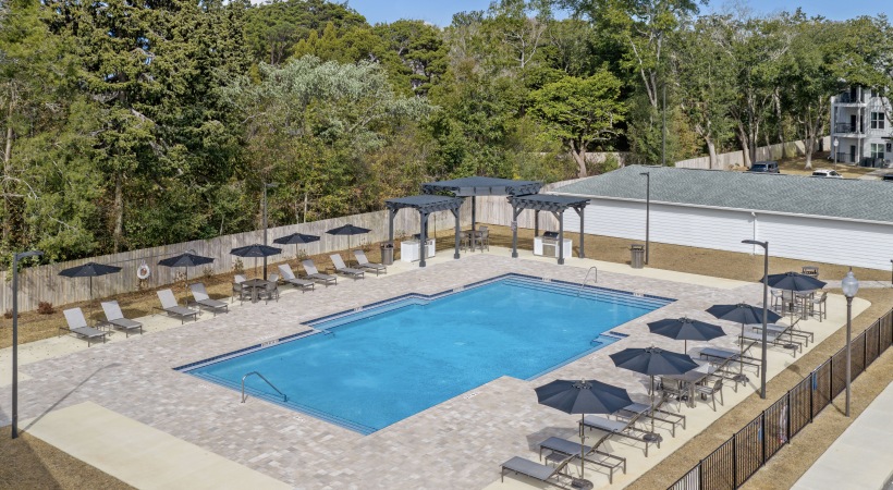 Arial of the resort-style pool area with lounge seating at City North in Pensacola, FL