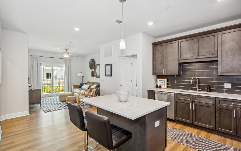 a kitchen with a dining table and chairs