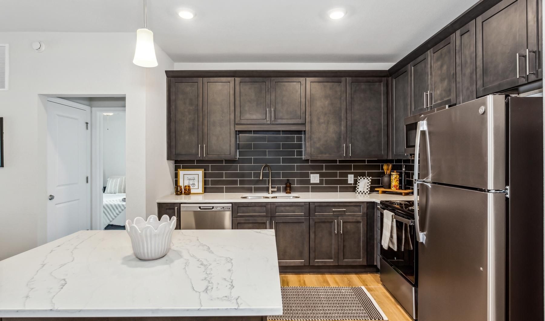 a kitchen with wood cabinets